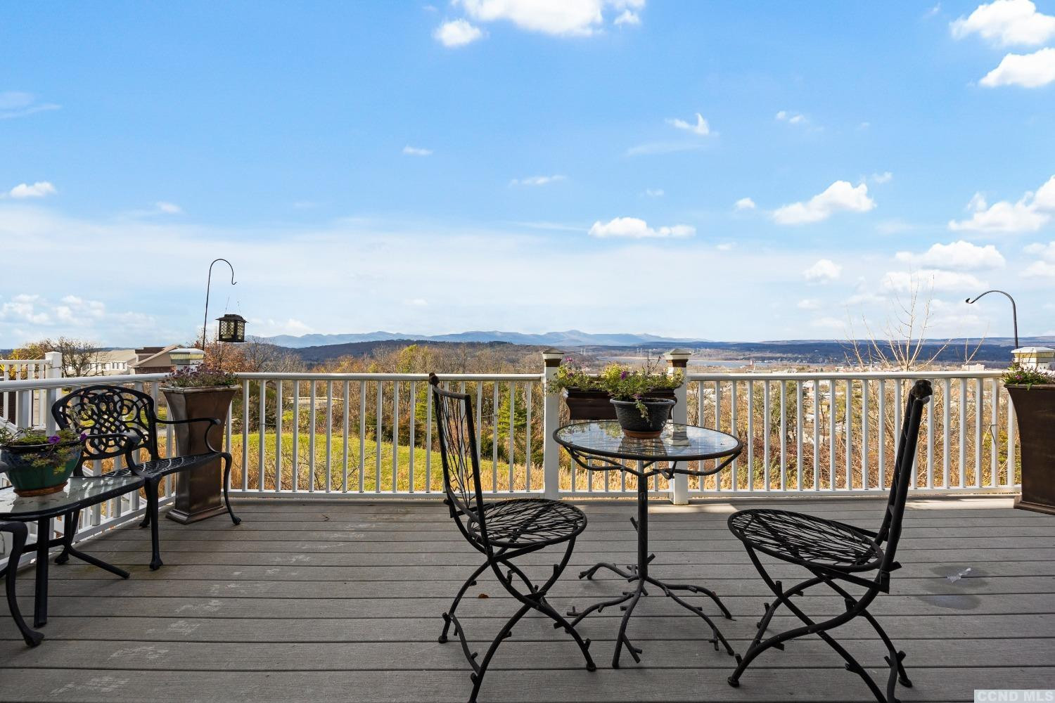 17 Academy Hill Drive Hudson, NY 12534 - Photo 12 of 35 a view of a balcony with chairs and wooden floor