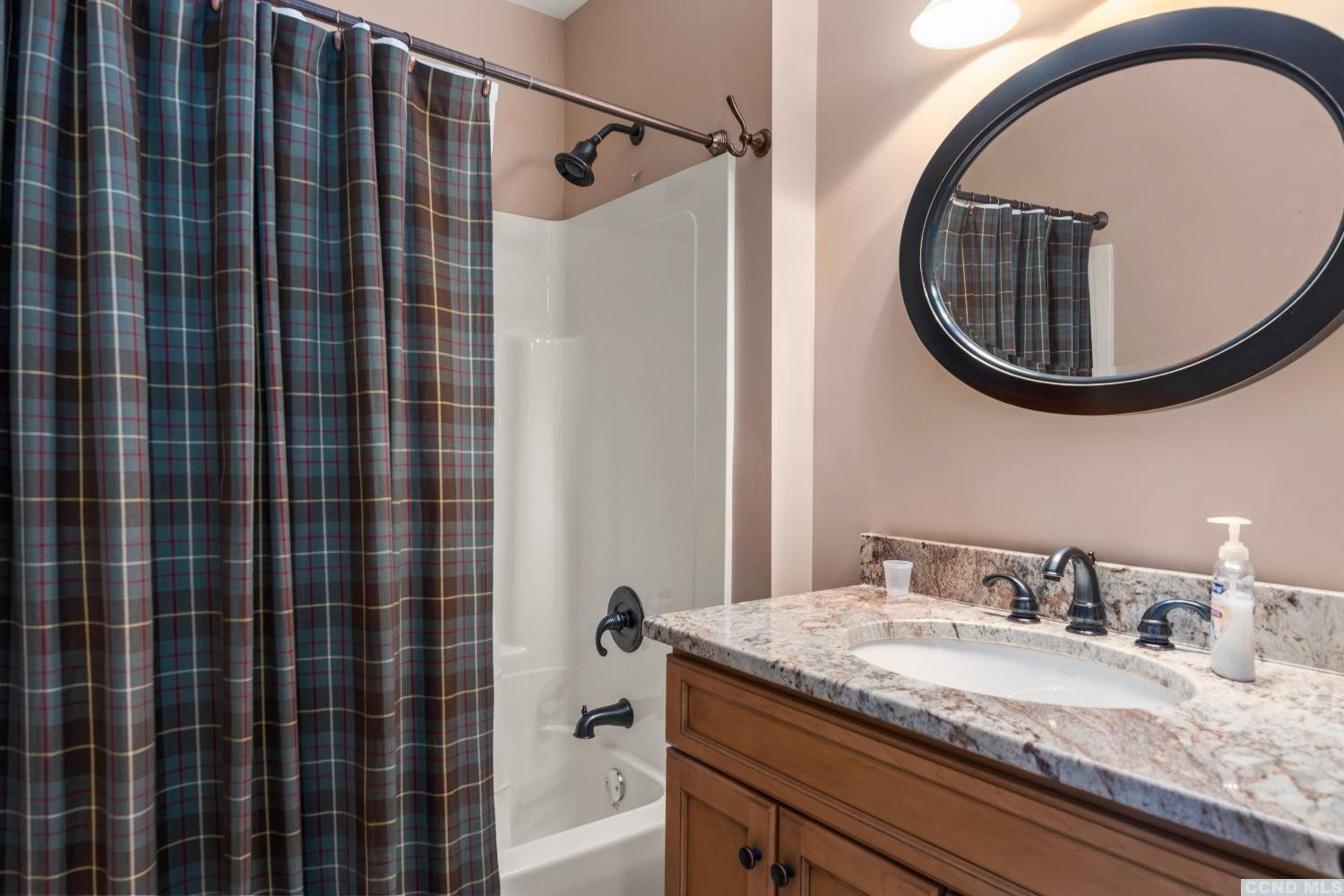 17 Academy Hill Drive Hudson, NY 12534 - Photo 22 of 35 a bathroom with a granite countertop sink a mirror and shower