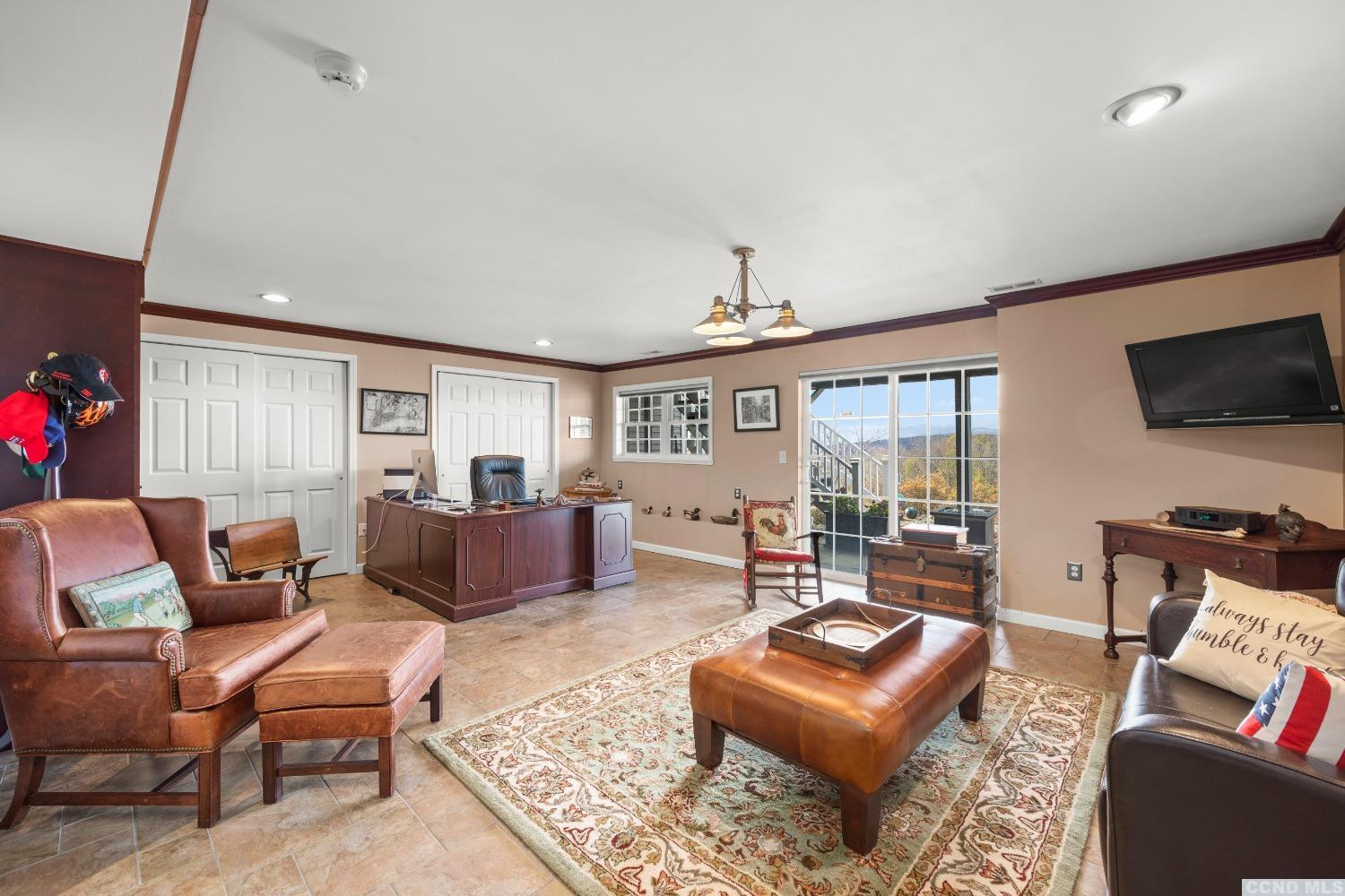 17 Academy Hill Drive Hudson, NY 12534 - Photo 23 of 35 a living room with furniture a rug and a flat screen tv