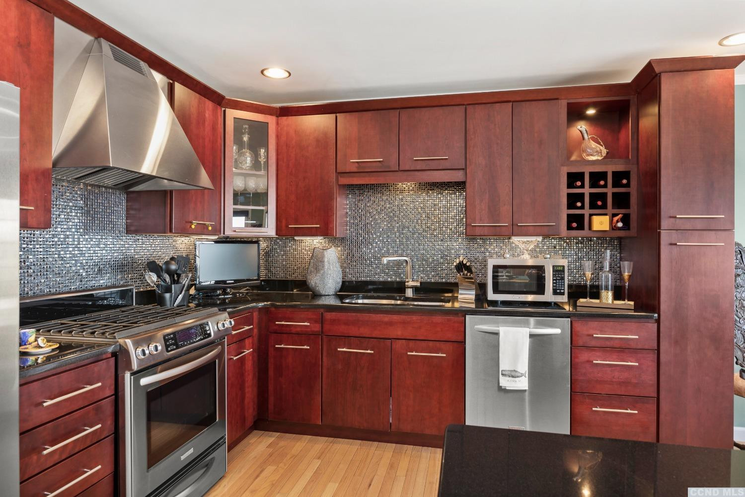 17 Academy Hill Drive Hudson, NY 12534 - Photo 8 of 35 a kitchen with stainless steel appliances granite countertop a stove sink and cabinets