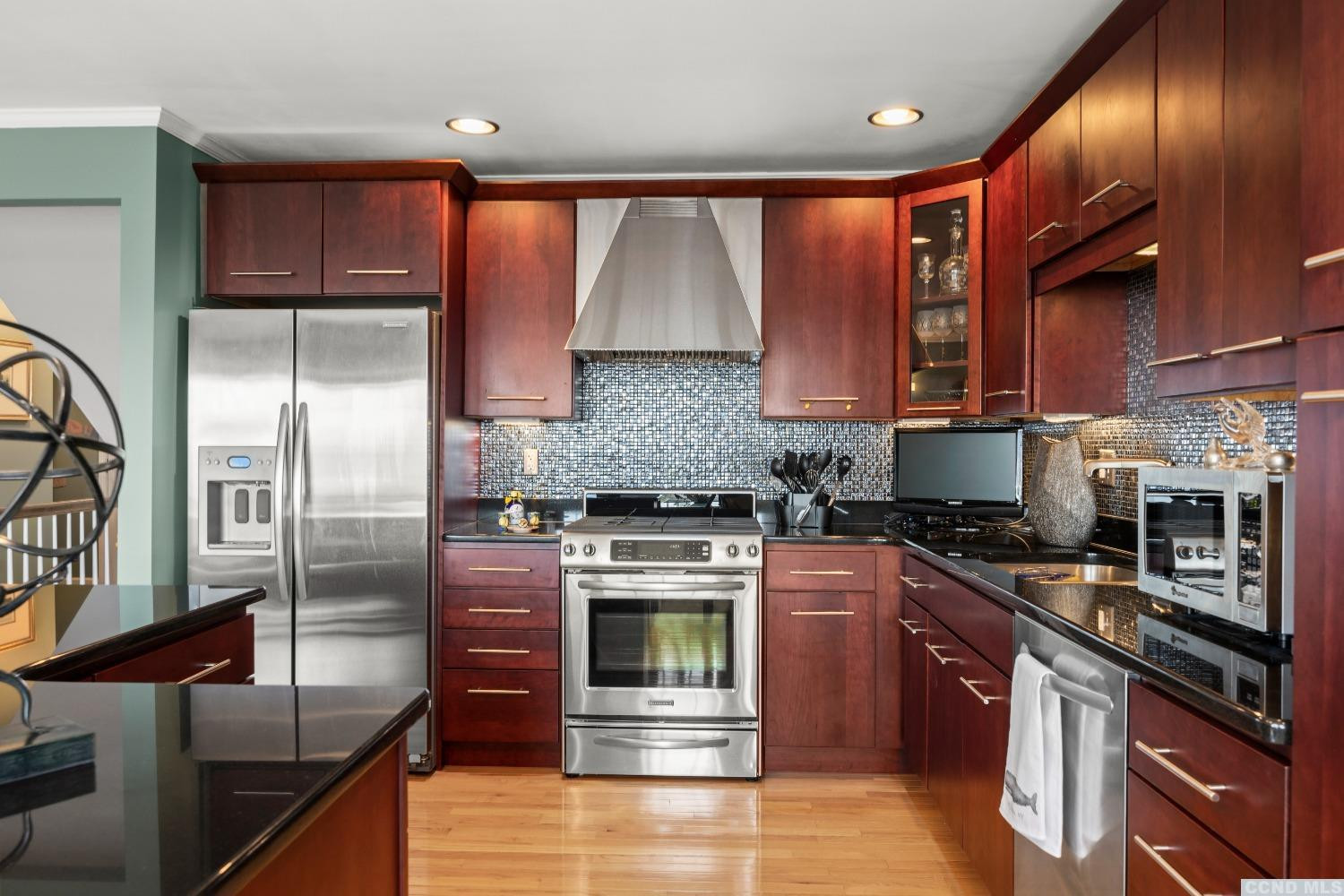 17 Academy Hill Drive Hudson, NY 12534 - Photo 9 of 35 a kitchen with stainless steel appliances granite countertop a stove top oven a sink and dishwasher