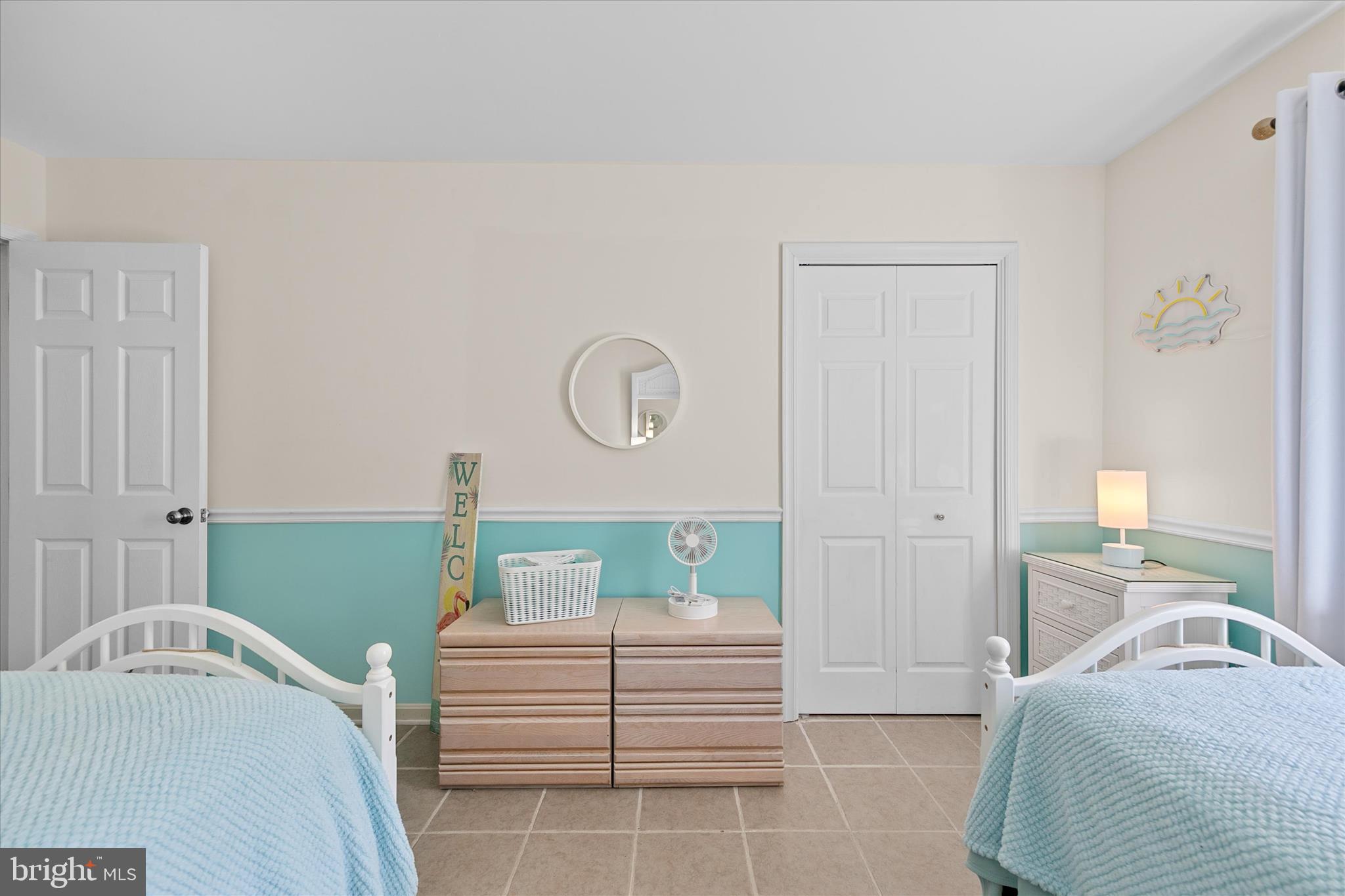 132 Jamestown Road, Unit 601 Ocean City, MD 21842 - Photo 23 of 37 a bedroom with a bed and a cabinets
