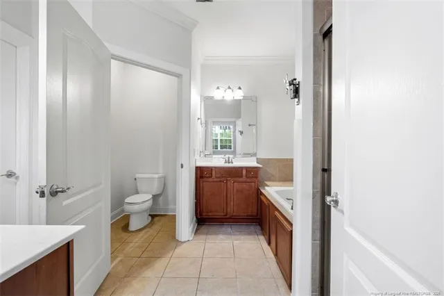 a bathroom with a double vanity sink mirror and shower