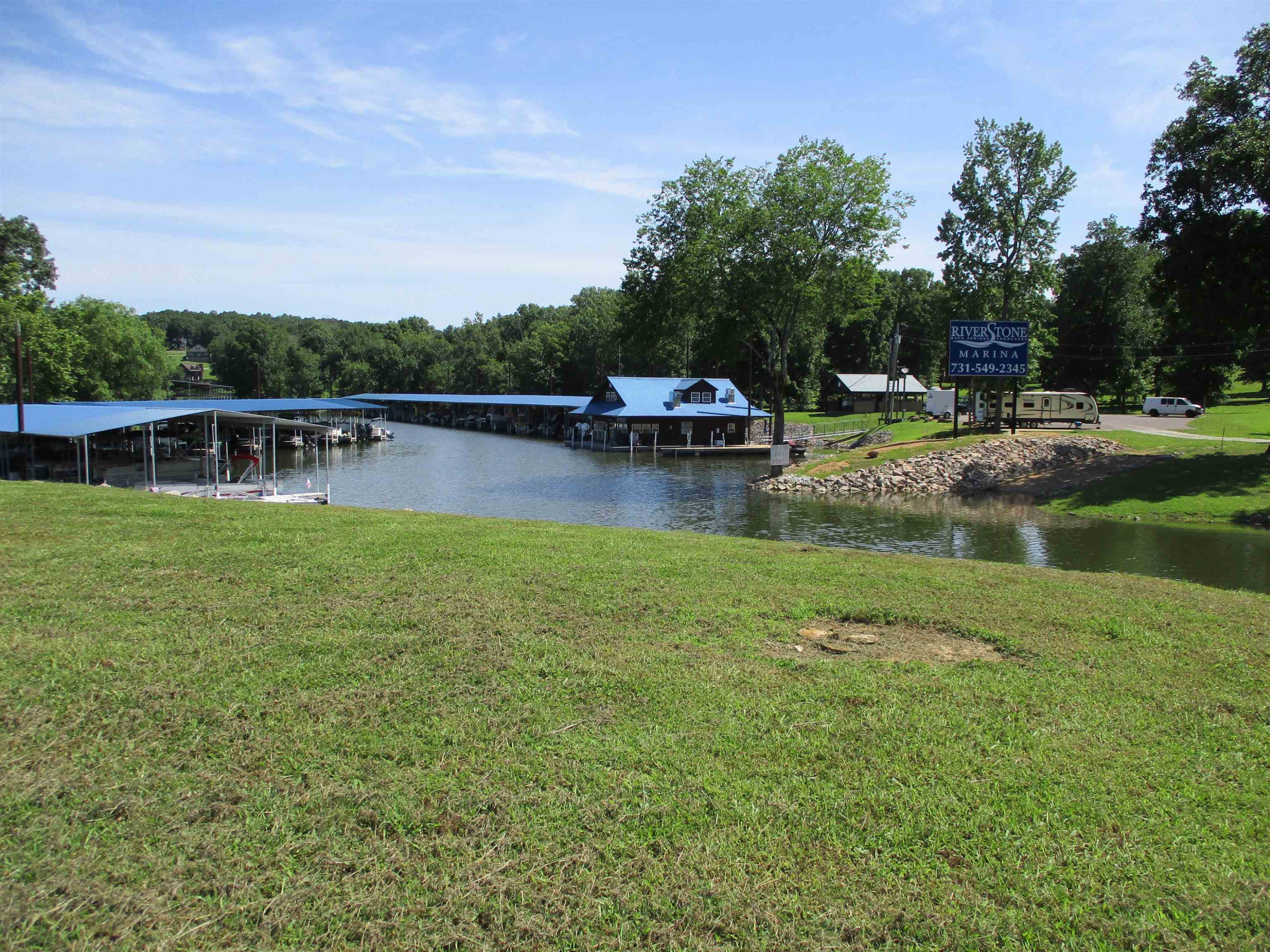 Lot 11 Riverstone Loop Bath Springs, TN 38311 - Photo 10 of 12 a view of a lake with houses in the back