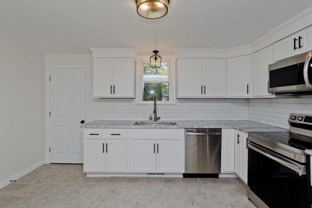 178 Palmer Road Monson, MA 01057 - Photo 10 of 30 a kitchen with appliances cabinets and a sink