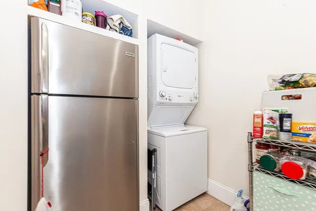a white refrigerator freezer sitting inside of a kitchen