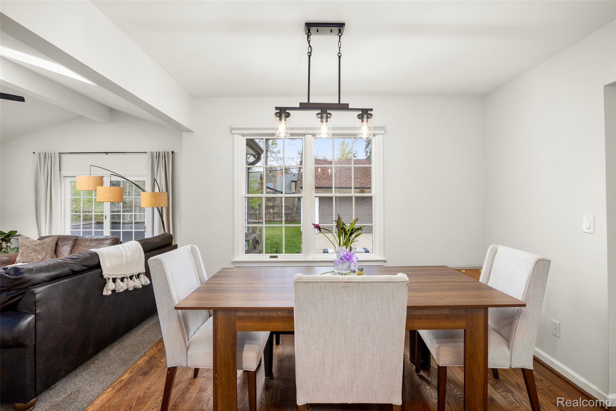 244 Kerby Road Grosse Pointe, MI 48236 - Photo 15 of 53 Dining space with wood finished floors and vaulted ceiling with beams