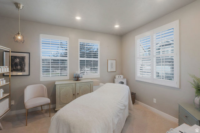 2319 North 3370 West Lehi, UT 84048 - Photo 14 of 30 Neutral-toned room featuring a light-colored carpet, recessed lighting, and a modern pendant fixture