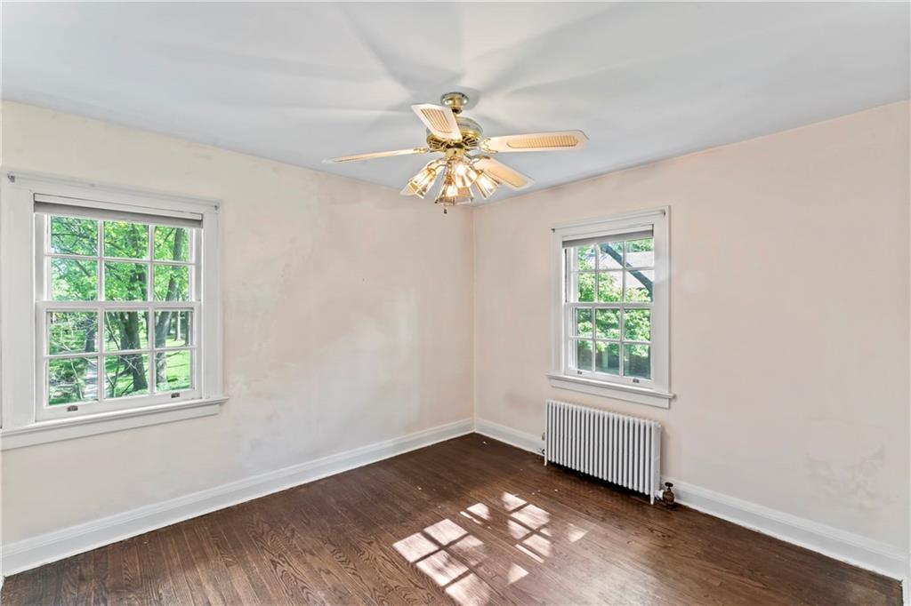 440 Olympia Road Pittsburgh, PA 15211 - Photo 11 of 25 a view of a livingroom with a window and wooden floor