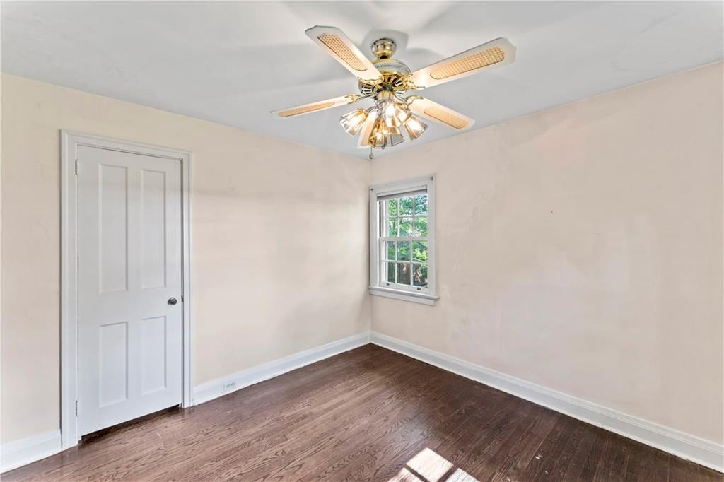 440 Olympia Road Pittsburgh, PA 15211 - Photo 12 of 25 a view of an empty room with window and wooden floor