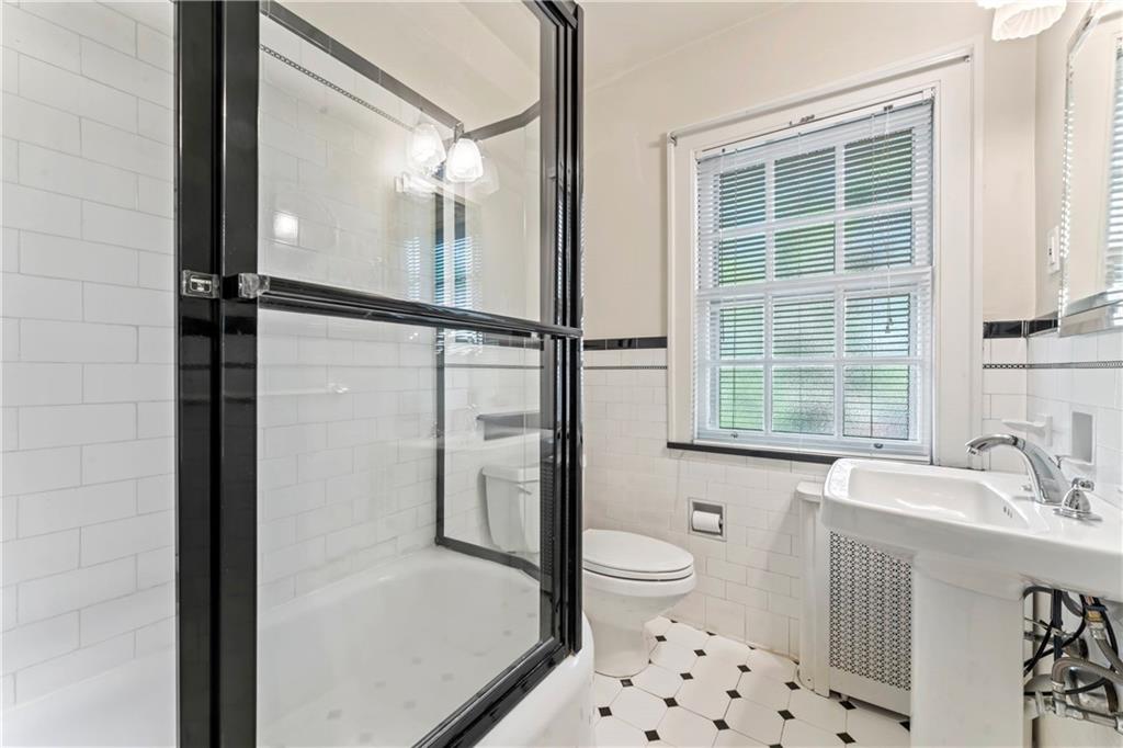 440 Olympia Road Pittsburgh, PA 15211 - Photo 14 of 25 a bathroom with a sink toilet and shower