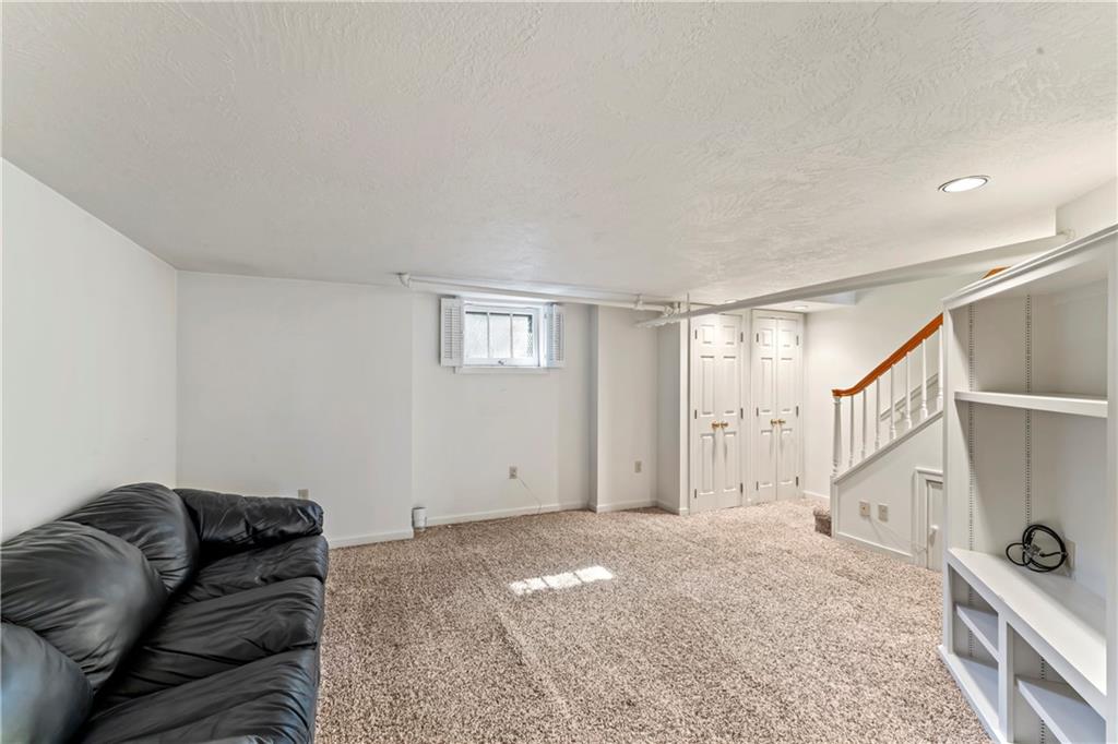440 Olympia Road Pittsburgh, PA 15211 - Photo 16 of 25 a bedroom with a bed and a couch