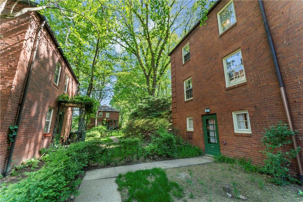 440 Olympia Road Pittsburgh, PA 15211 - Photo 22 of 25 a front view of a house with plants and garden