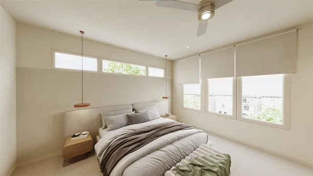 a room with a large window and furniture