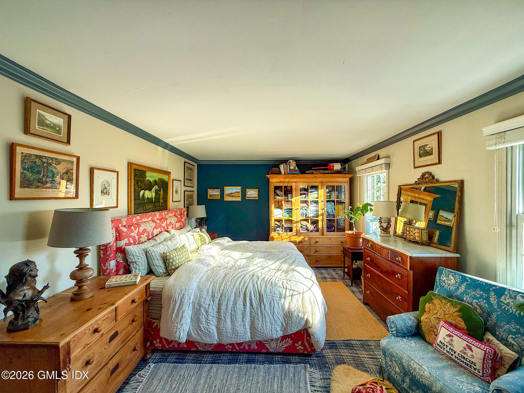 9 Weaver Street, Unit 9 Greenwich, CT 06831 - Photo 16 of 18 a bedroom with bed and wooden floor