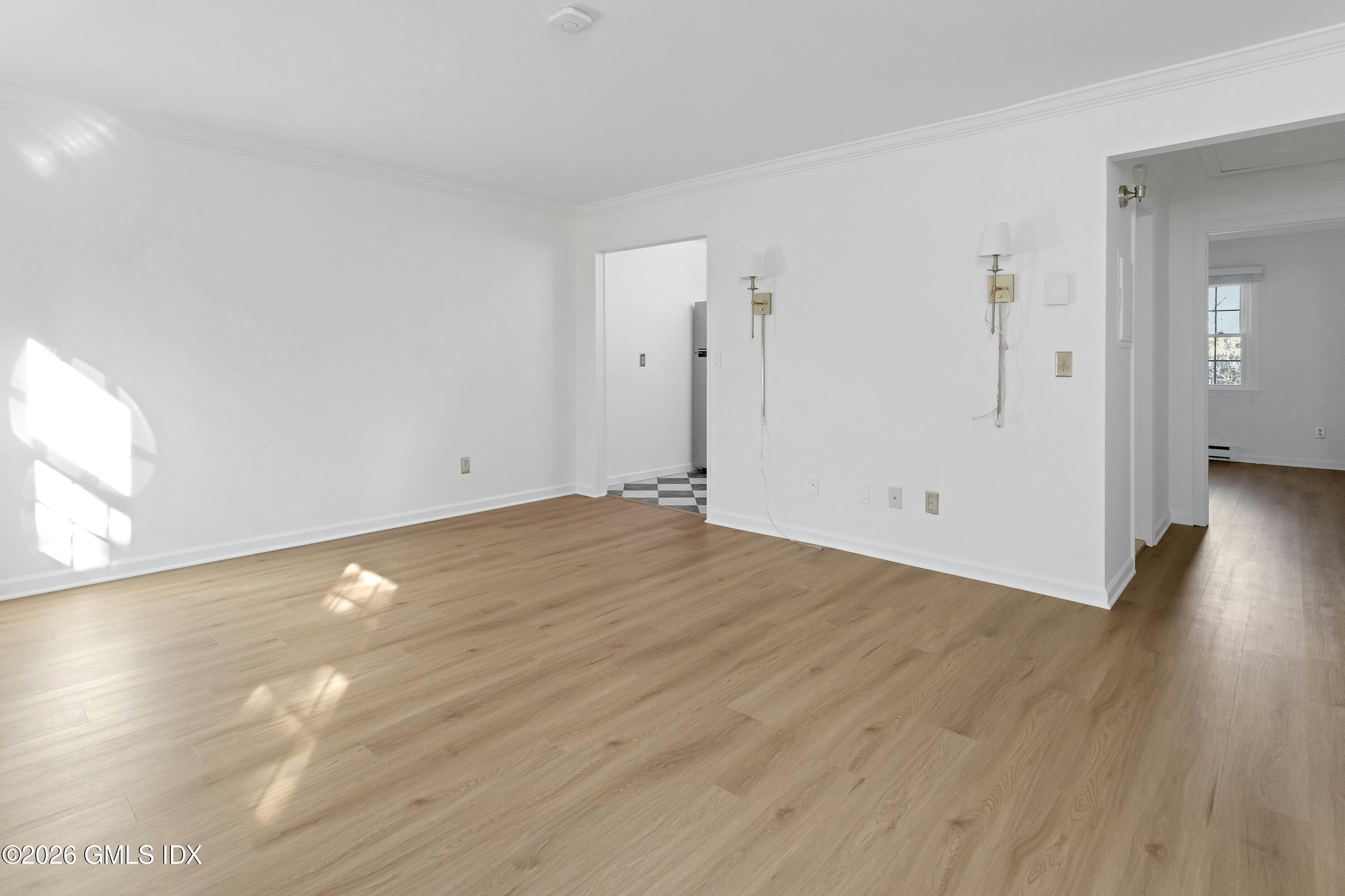 9 Weaver Street, Unit 9 Greenwich, CT 06831 - Photo 4 of 18 a view of empty room with wooden floor
