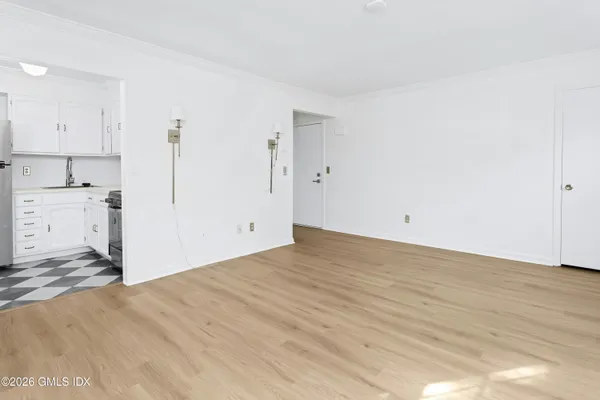 a view of a kitchen with a sink and cabinets