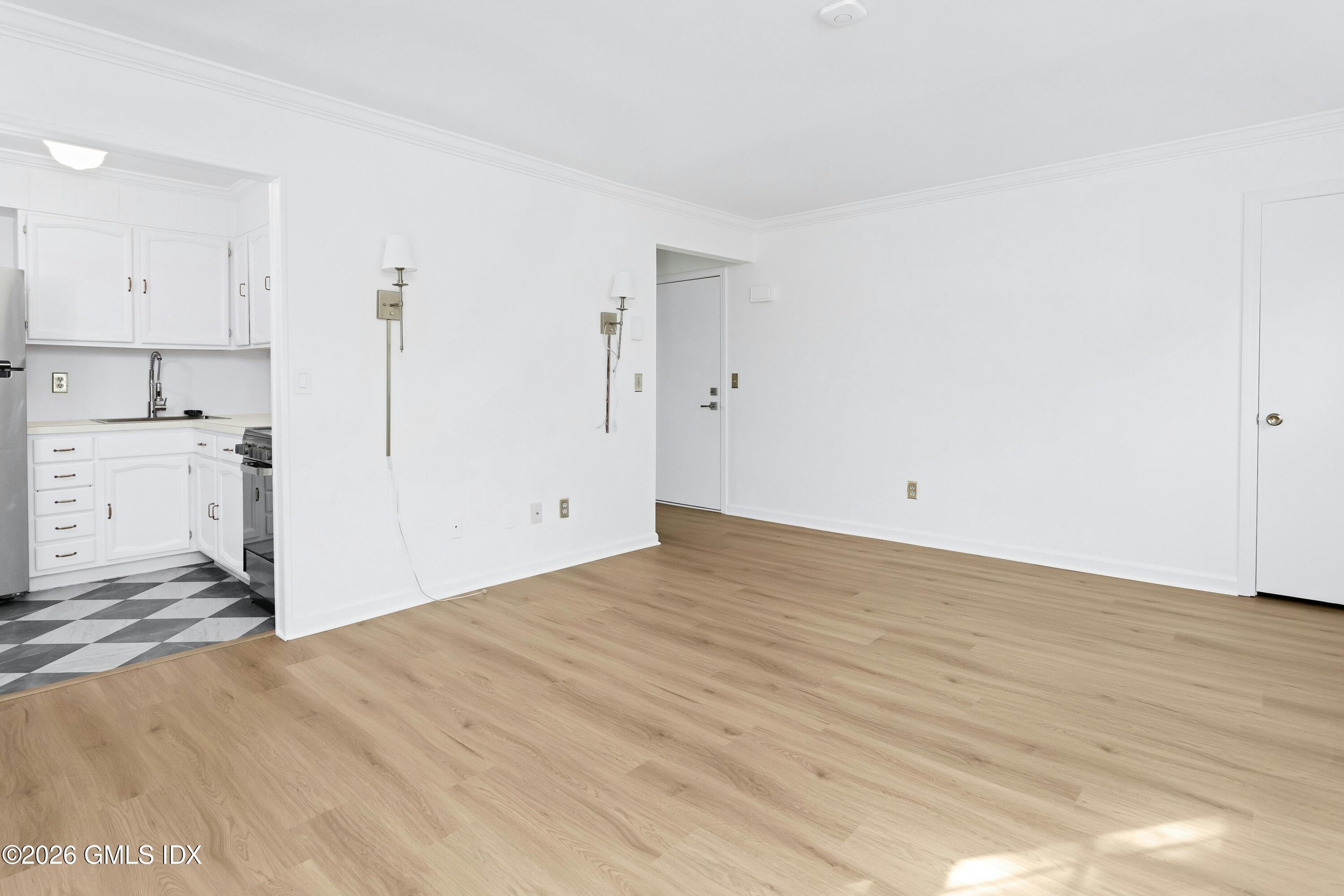 9 Weaver Street, Unit 9 Greenwich, CT 06831 - Photo 5 of 18 a view of a kitchen with a sink and cabinets