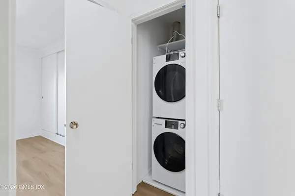 a view of a hallway with washer and dryer
