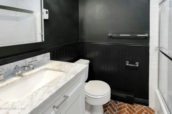 a bathroom with a sink and a toilet
