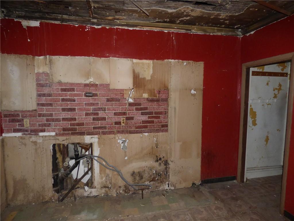 211 Amherst Street Pittsburgh, PA 15220 - Photo 21 of 40 a room with water heater and a wooden table