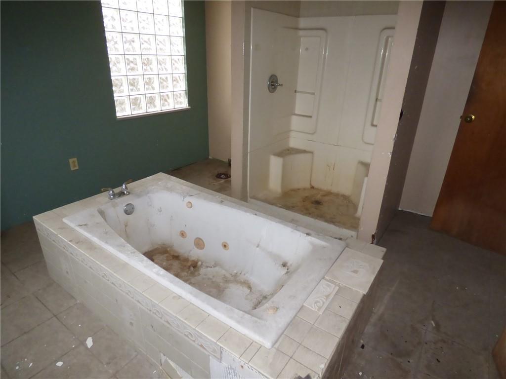 211 Amherst Street Pittsburgh, PA 15220 - Photo 30 of 40 a white bath tub sitting in a bathroom