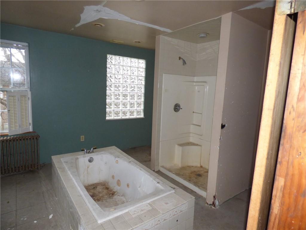 211 Amherst Street Pittsburgh, PA 15220 - Photo 34 of 40 a bathroom with a tub a sink and a window