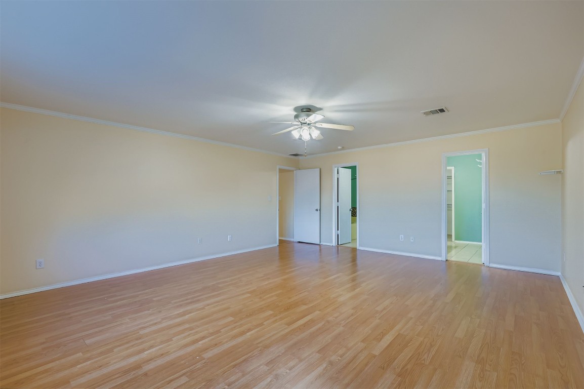 1105 American Robin Path Pflugerville, TX 78660 - Photo 15 of 32 a view of an empty room with wooden floor