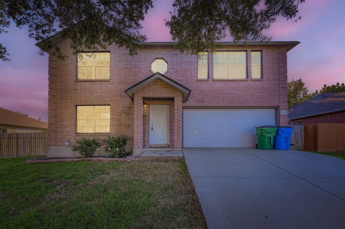 1105 American Robin Path Pflugerville, TX 78660 - Photo 29 of 32 a front view of a house with a yard and garage