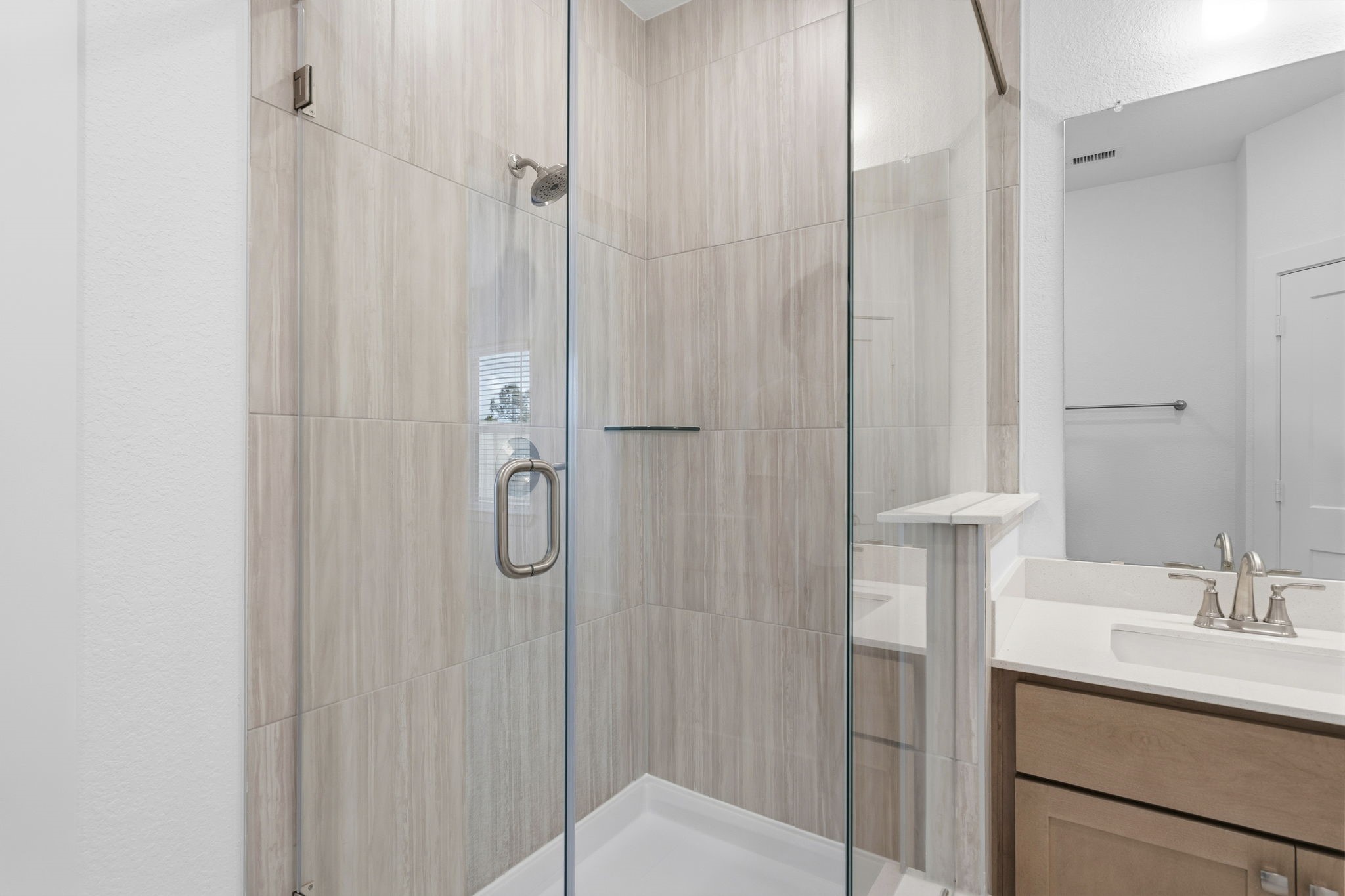 5251 Celestial Court Rosharon, TX 77583 - Photo 25 of 46 a bathroom with a shower sink and mirror