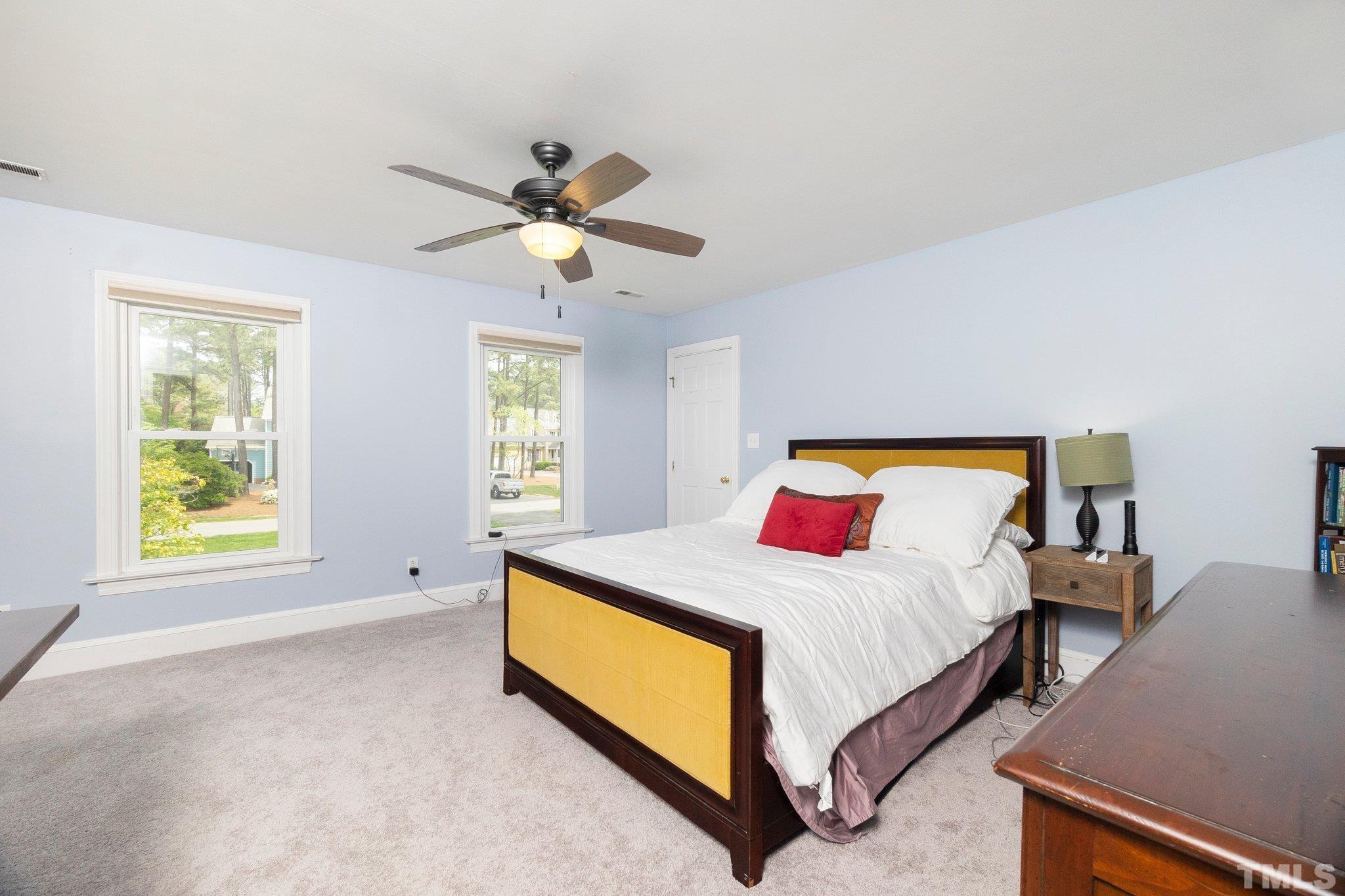 2761 Farnborough Road Raleigh, NC 27613 - Photo 21 of 30 a bedroom with a bed and a window