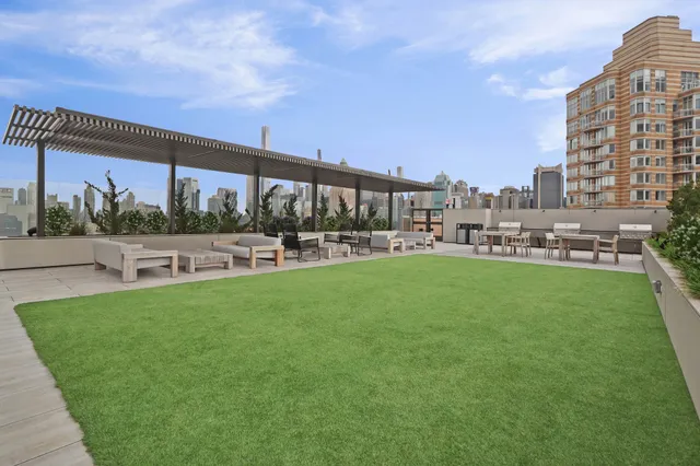 a view of a swimming pool and a yard