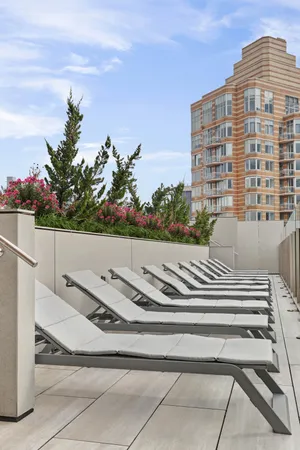 a view of building with yard and staircase
