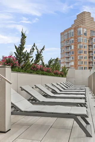 a view of building with yard and staircase