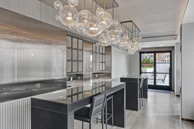 a kitchen with a table chairs and microwave