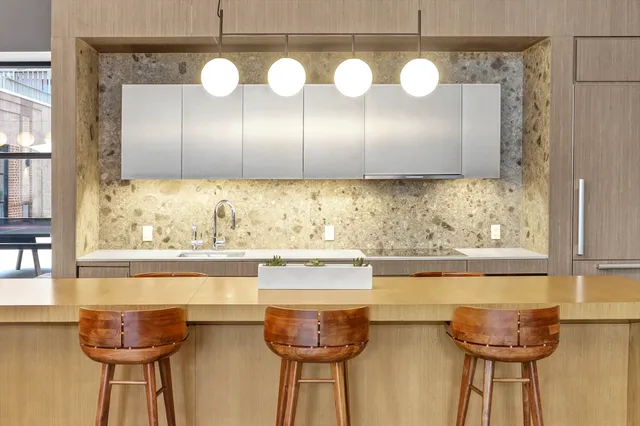 a kitchen with a table and chairs in it