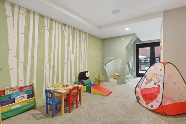 a view of a livingroom with furniture and toys