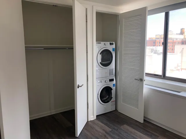 a view of a hallway with washer and dryer