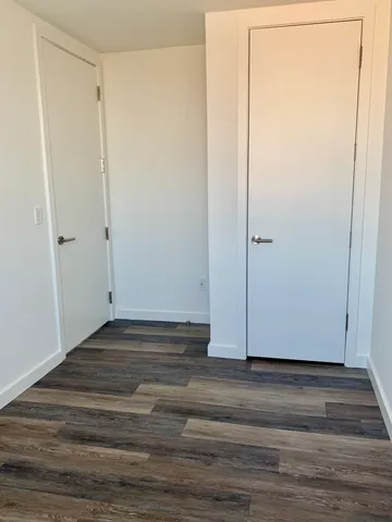 a view of a small space with wooden floor