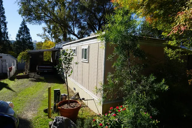 a backyard of a house with lots of green space