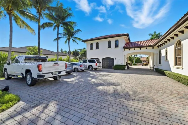 a view of a backyard with garden and patio