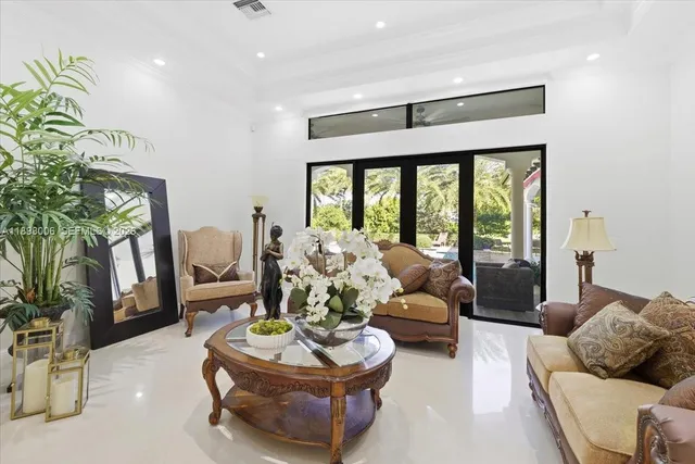 a view of a house with a yard and potted plants