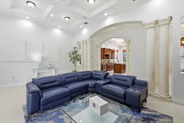 an aerial view of residential houses with outdoor space and trees all around