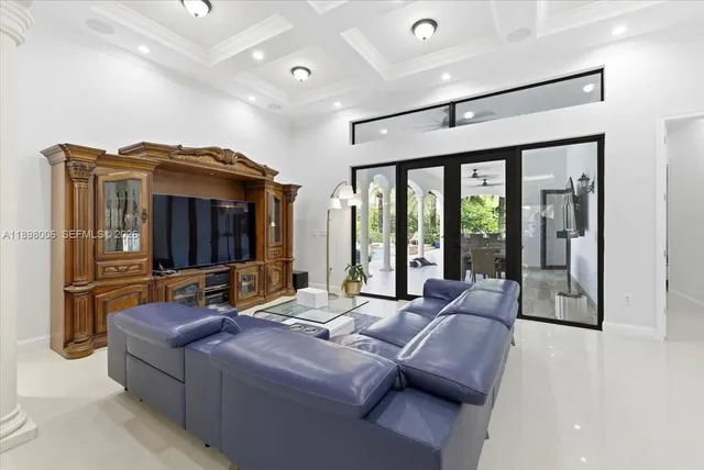 an aerial view of residential houses with outdoor space and trees all around