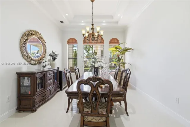 an aerial view of residential houses with outdoor space and trees all around