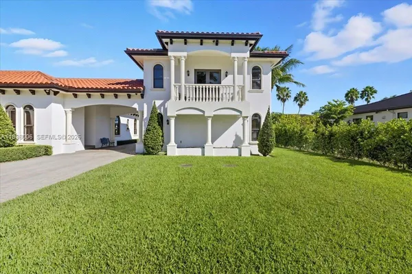 front view of a house with a garden
