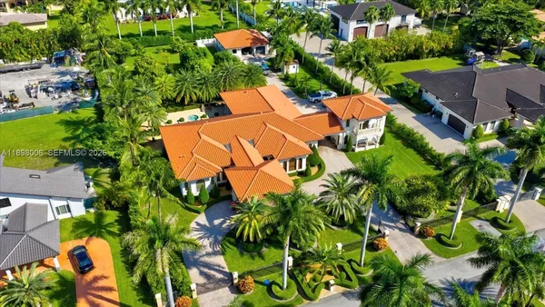 an aerial view of a house with a garden