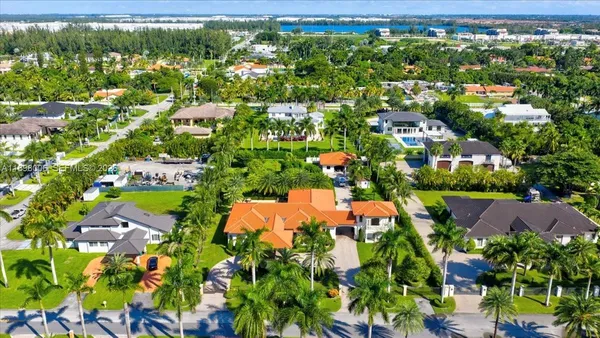 a view of a cars park in front of a building