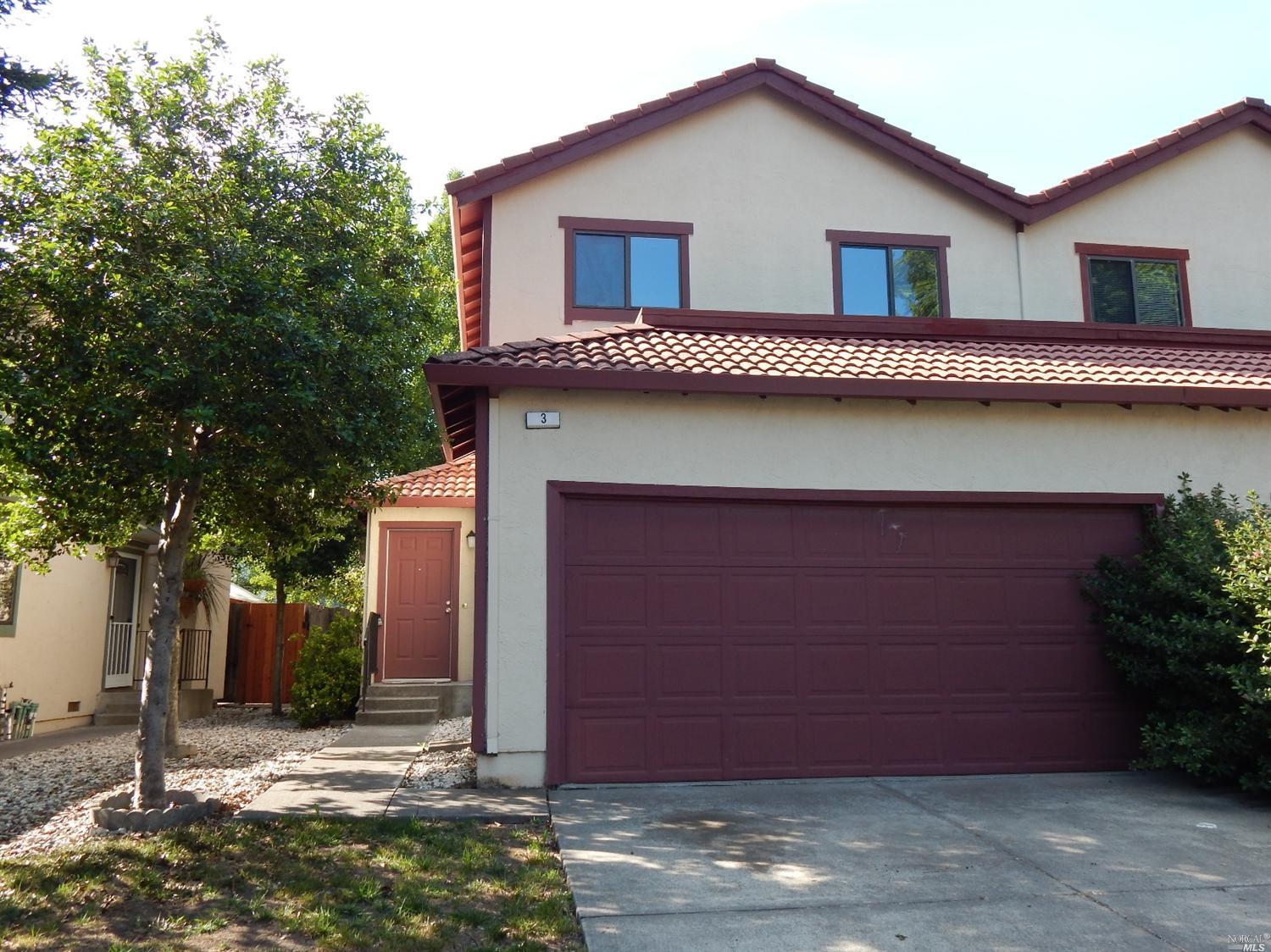 a house with tree in front of it