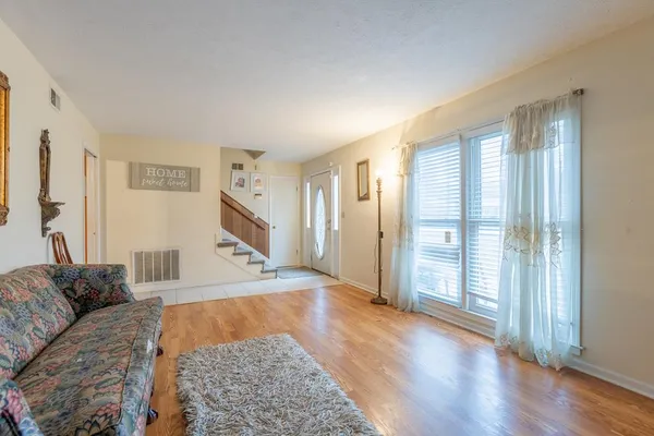 a view of livingroom with furniture and wooden floor